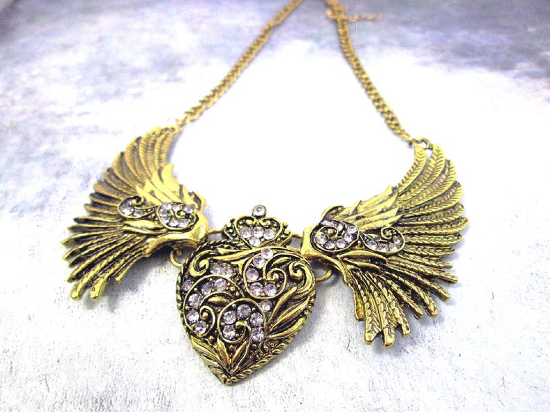 large angel wings with heart bib necklace, antique gold color