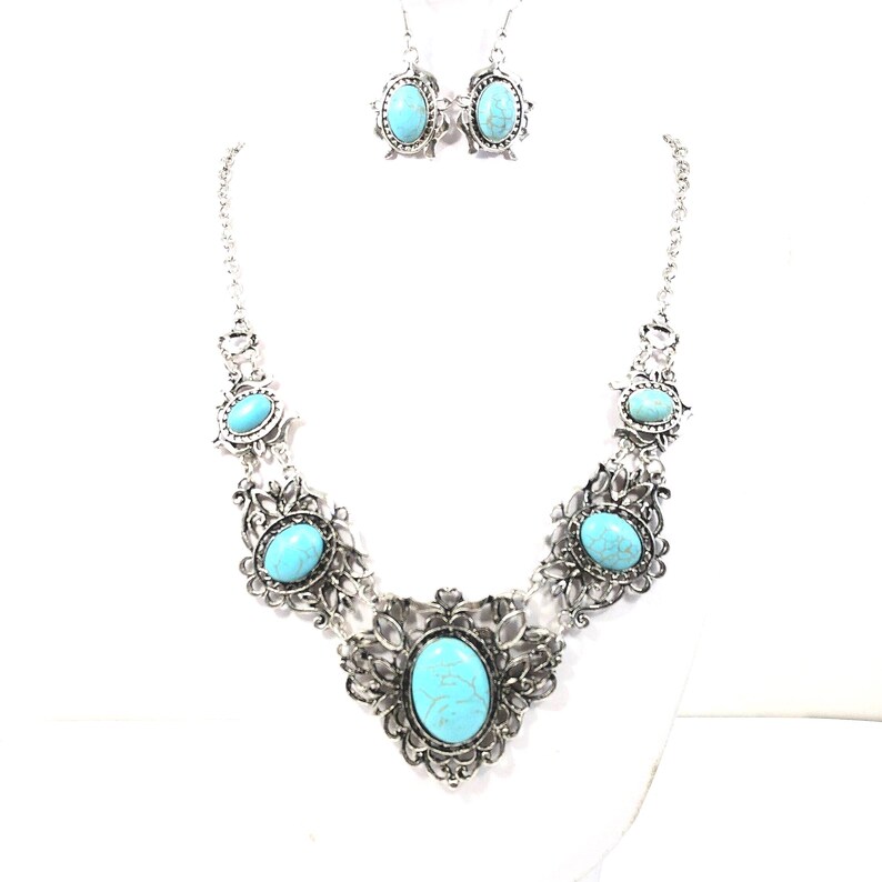 filigree turquoise necklace and earring set, antique silver color, for women. (photo of necklace set taken on a white mannequin with white background)