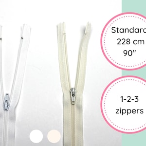 May include: Three white zippers, two are white and one is off-white. The zippers are 90 inches long. The text "Standard 228 cm 90" is in a pink circle with a dotted border. The text "1-2-3 zippers" is in a pink circle with a dotted border.