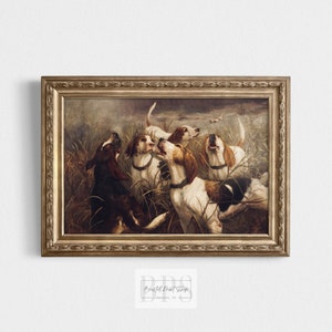May include: A vintage oil painting in a gold frame depicts a group of hunting dogs in a field of tall grass. The dogs are all brown and white with long ears and are looking up at something off-screen. The painting is set against a cloudy sky.
