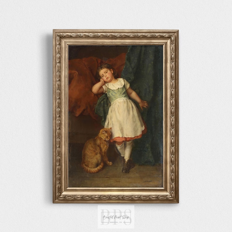 May include: A framed oil painting depicting a young girl asleep with a ginger cat by her side. The girl is wearing a white dress with a blue bodice and red trim. The painting has a dark green background.
