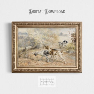 May include: A vintage watercolour painting of three hunting dogs in a wooded landscape. The dogs are brown and white with long ears and tails. The painting is framed in a gold frame.