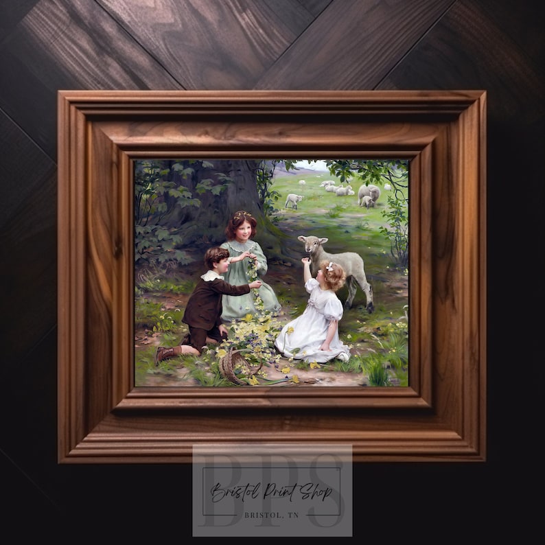 May include: A painting depicting three children in a woodland scene. Two girls and a boy are interacting with a white lamb. The children are dressed in clothing from the early 1900s. The painting is framed in a dark wood frame.