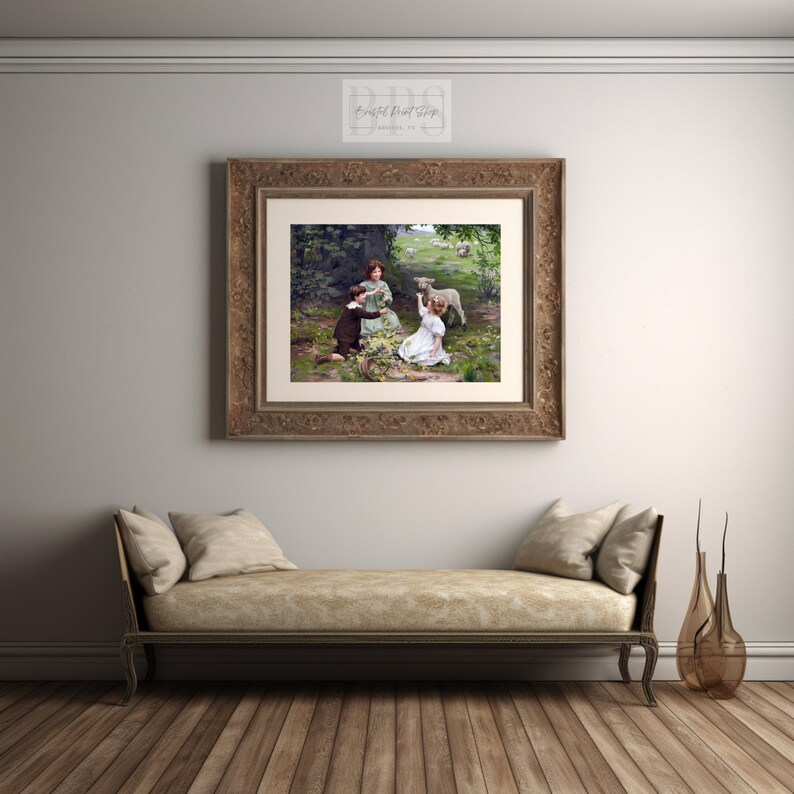 May include: A vintage painting depicting three children in a woodland scene. Two children are interacting with a small lamb, while the third child observes. The painting is framed in an ornate gold frame.