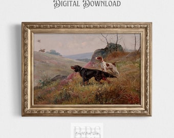 May include: A vintage painting of two hunting dogs in a field. The dogs are a black and brown pointer and a white and brown pointer. The dogs are standing in a field of green grass and wildflowers. The painting is framed in a gold frame.