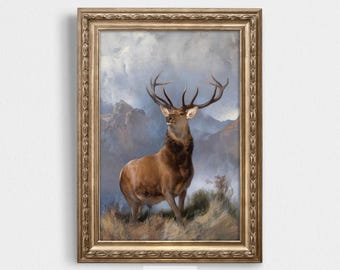 May include: A framed digital download print featuring a majestic stag with large antlers, set against a backdrop of mountains and a cloudy sky. The artwork is in a vintage style, with a gold-colored ornate frame. The text "DIGITAL DOWNLOAD" is at the top.