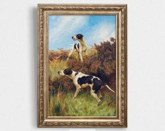 May include: A framed painting of two English Pointer dogs in a field. The dogs are white with black markings and are standing in a hunting pose. The background is a field of green grass and brown bushes. The sky is blue with white clouds.