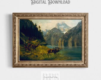 Può includere: Un dipinto vintage che rappresenta una scena di lago di montagna con un gruppo di cervi in primo piano. Il dipinto è incorniciato in una cornice dorata.