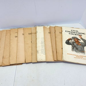 May include: A stack of vintage books with brown covers. The top book has the title "Civil Engineering Courses" and the text "International Correspondence Schools Scranton, Pa., U.S.A."