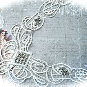 May include: White lace trim with a delicate floral pattern and small silver beads. The trim is perfect for adding a touch of elegance to any project.