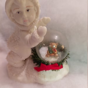 Vintage Porcelain Snow Baby Figurine with Christmas Snow Globe