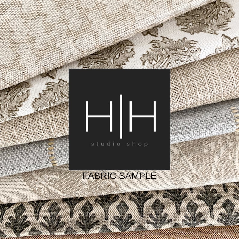 May include: A stack of fabric samples in various patterns and colors, including beige, brown, gray, and black. The fabric samples are arranged in a staggered pattern. A black square with the text "H|H studio shop" and "FABRIC SAMPLE" is in the center of the image.