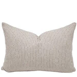 May include: A rectangular throw pillow featuring a textured off-white fabric base with vertical stripes in a muted grey tone. The pillow has a soft, slightly plumped appearance with a consistent woven pattern across the entire front surface.