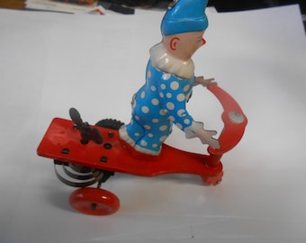 Tin Windup Toy CLOWN on Red Scooter