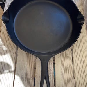 May include: A set of three ceramic mugs with a speckled, matte finish. The mugs are in shades of cream, light gray, and dark gray. Each mug has a simple, minimalist design, perfect for coffee or tea.