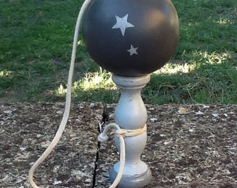 wood Bilboquet patina in shades of gray and dark gray
