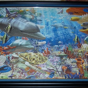 Professionally framed wall art, home decor, and office decor.  3000 piece completed Ocean Ravensburger puzzle framed by Pictures Plus.