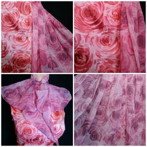 May include: A pink sheer fabric with a rose print. The fabric is pleated and has a soft, flowing texture.