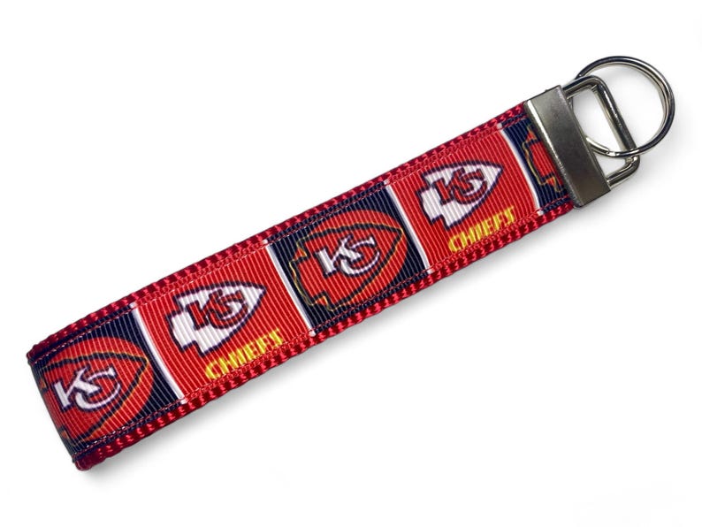 May include: Red, white, and blue key chain with the Kansas City Chiefs logo and "Chiefs" text.