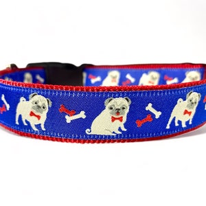 May include: Blue dog collar with a red border and a pattern of white pugs wearing bow ties and red bones.