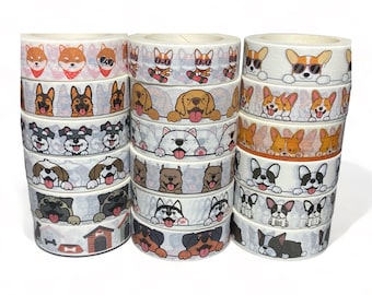 May include: A stack of washi tape rolls featuring various dog breeds, including corgis, pugs, french bulldogs, and schnauzers. The tape is white with black outlines and colorful accents.