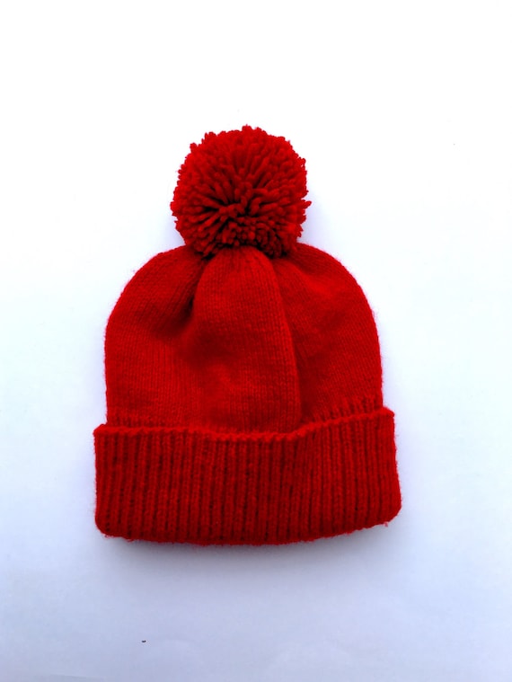 red pom pom hat