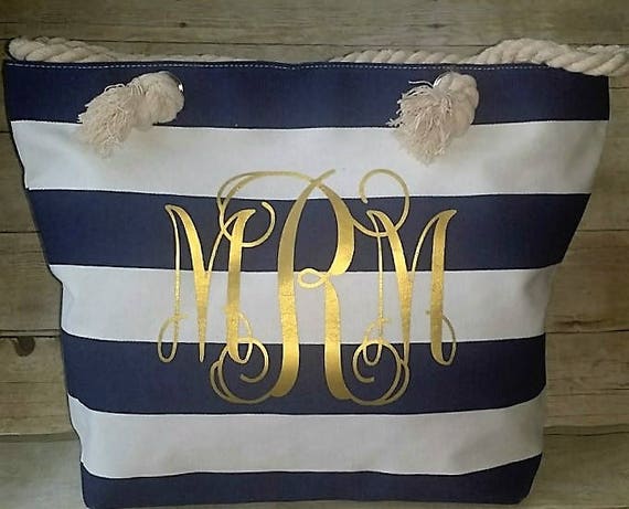 A SET OF TWO: A LIMITED EDITION GOLD SEQUIN & MONOGRAM CANVAS