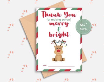 May include: A printable thank you card with a red and green striped border. The card features a cartoon reindeer with a string of lights on its antlers. The text on the card reads "Thank You for making school merry & bright". The card is 5x7 inches.