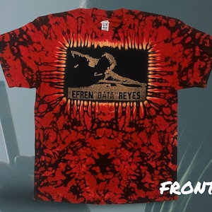 May include: Red, black, and orange tie-dye t-shirt with a black and white image of a person playing pool. The text "EFREN 'BATA' REYES" is printed in gold on the shirt.
