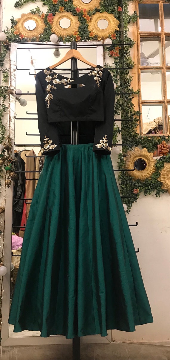 green skirt black top