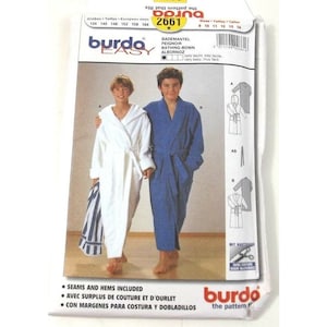 May include: Burda Easy sewing pattern number 2661 for a bathrobe. The pattern includes instructions for making a white bathrobe with a hood and a blue bathrobe with a hood. The pattern is for sizes 9 to 14.