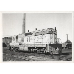 May include: A black and white photograph of a Union Pacific diesel locomotive, number 783, with the number 222 on the side. The locomotive is on a set of railway tracks.