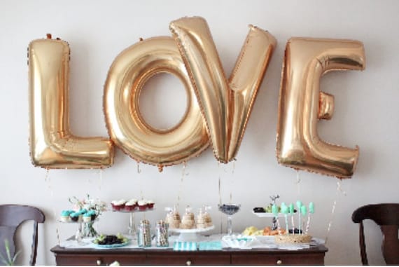 Giant gold on sale love balloons
