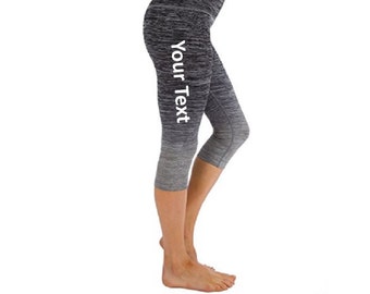 May include: Black and grey ombre cropped leggings with the text "Your Text" printed on the side.