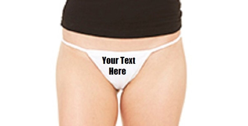 May include: White string bikini with the text "Your Text Here" printed on the front.