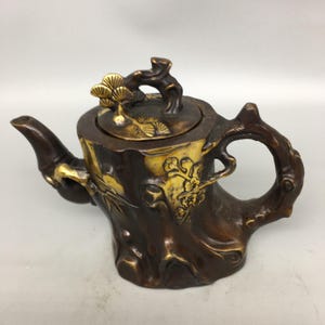 Adorno de tetera antigua china hecha a mano, tallada en cobre puro dorado, con forma de árbol, rara y exquisita.