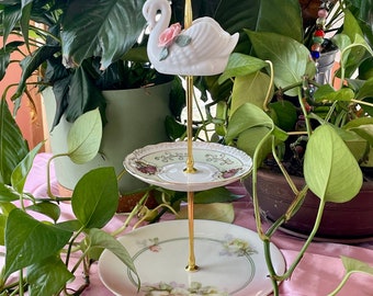 Tiered Tea Server made from mix and match fine china featuring swan symbolism, peace roses, &  gold trimmed Victorian courting couples. Pink