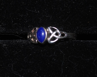 Sterling silver ring size 6.75 with lapis setting.