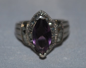 Sterling silver ring size 7.75 with Amethyst setting.