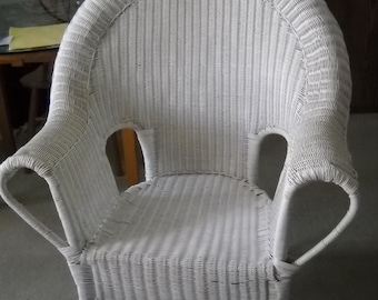 White wicker arm chair with pillow made with Ralph Lauren fabric. Local pick up in Sunny Isles Beach, FL 33160. No shipping.