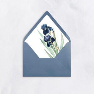 May include: A blue envelope with a white card inside. The card features a watercolor illustration of two dark blue irises with green leaves.