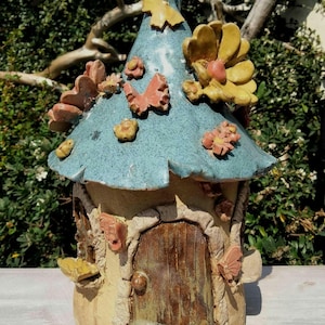 Make a Pottery Fairy House Tea light holder. Printable template and instructions.
