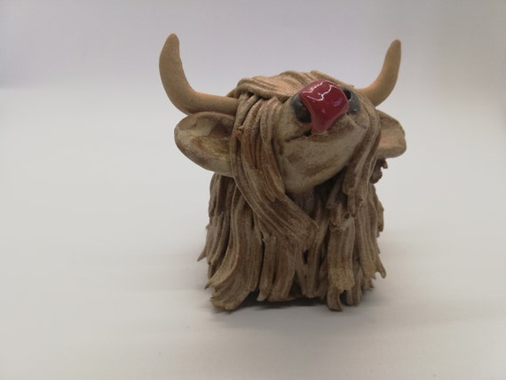Handmade Highland Cow licking her nose