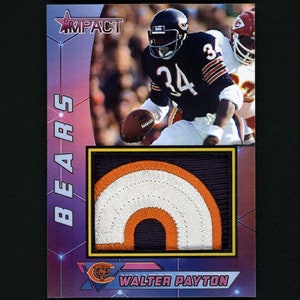 May include: A vintage football card featuring Walter Payton, a former running back for the Chicago Bears. The card has a purple, blue, and white background with a gold border. The card features a photo of Payton running with the football. The card also includes a patch of a Chicago Bears logo.