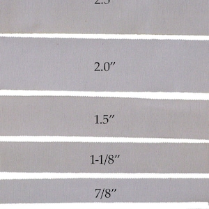 May include: Six samples of gray grosgrain ribbon in different widths, labeled with their measurements in inches: 2.5", 2.0", 1.5", 1-1/8", 7/8", 5/8", and 3/8".
