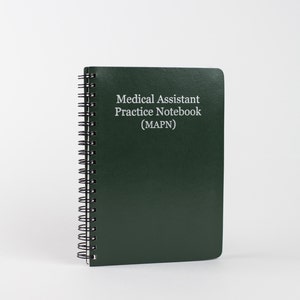 May include: A dark green spiral bound notebook with the text "Medical Assistant Practice Notebook (MAPN)" printed in white.