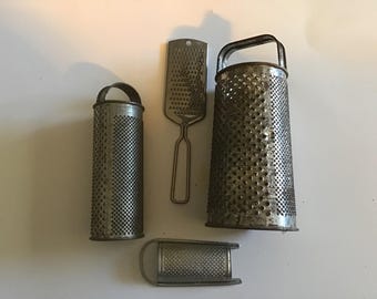 Set of 4 assorted shredders/graters. #3205