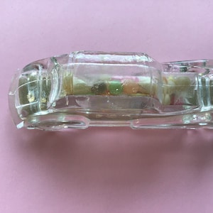 Vintage clear glass car candy container with original label and candy pieces. 4 1/2&quot; x 1 1/4&quot; x 1 3/16&quot;. #2043