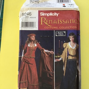 May include: Simplicity Renaissance Costume Collection sewing pattern. The pattern envelope features images of Renaissance-era costumes. The front of the envelope displays the Simplicity logo, pattern number 9246, and the designer's name, Andrea Schewe.