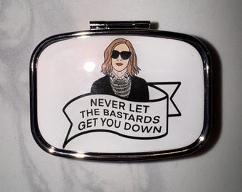 Schitt’s Creek Moira “Never Let The Bastards Get You Down” Inspired Pill Case
